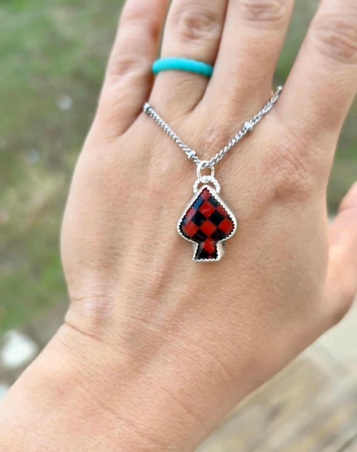 Black and red checker print spade necklace