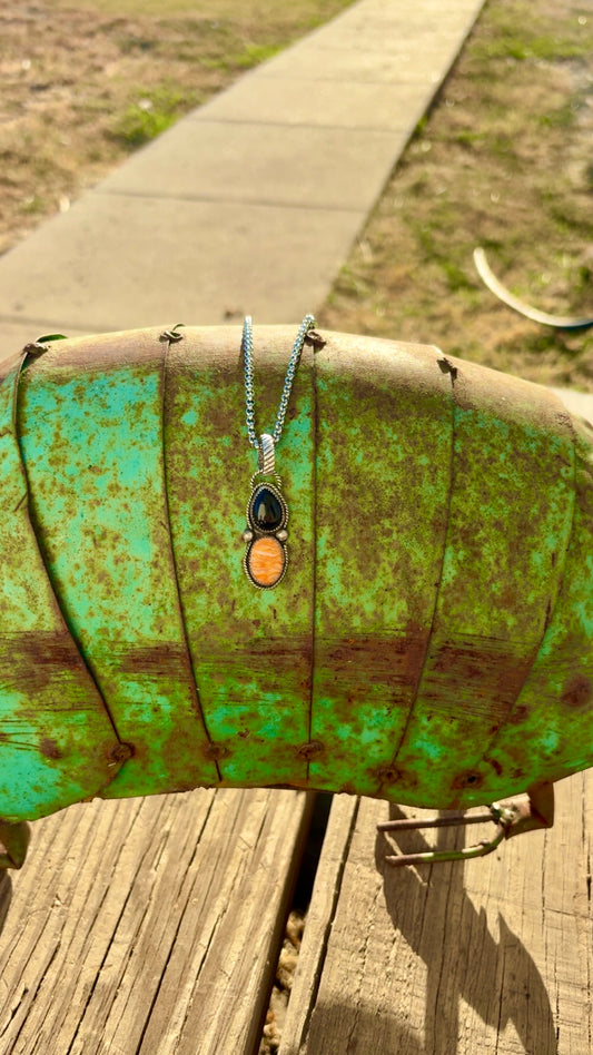 Orange spiny and black onyx pendent